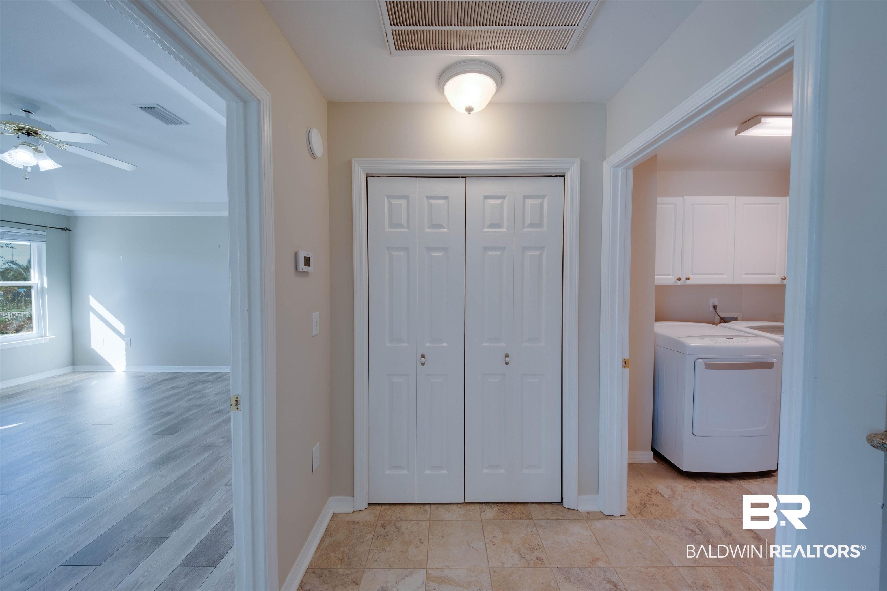 9462 Lakeview Drive Foley, AL 36535 - Photo 19 of 50 Laundry room featuring light hardwood / wood-style floors, ceiling fan, cabinets, and washer / clothes dryer