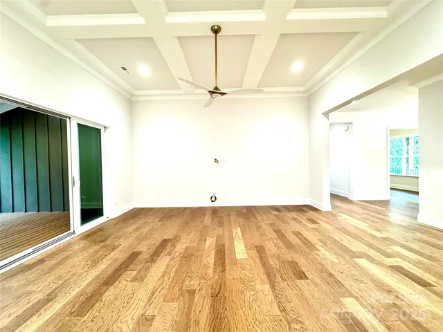 a view of a room with a ceiling fan