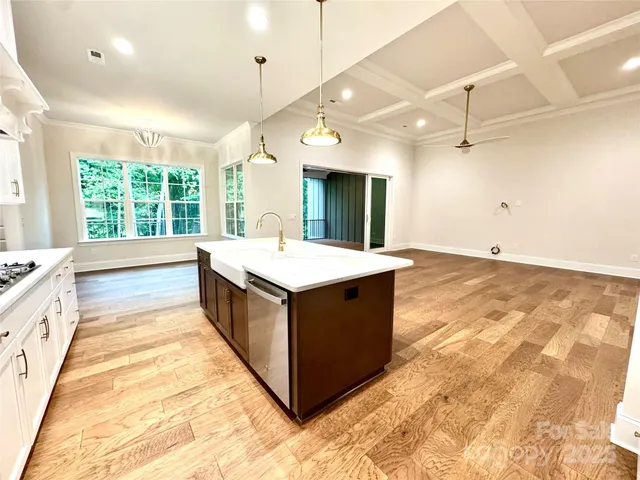 a spacious bathroom with a double vanity sink and a large mirror