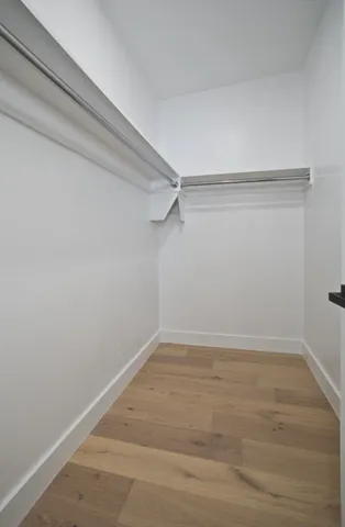 a view of a room with shelf on the wall