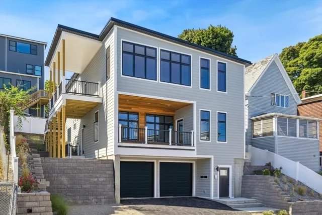 a view of a brick house with many windows