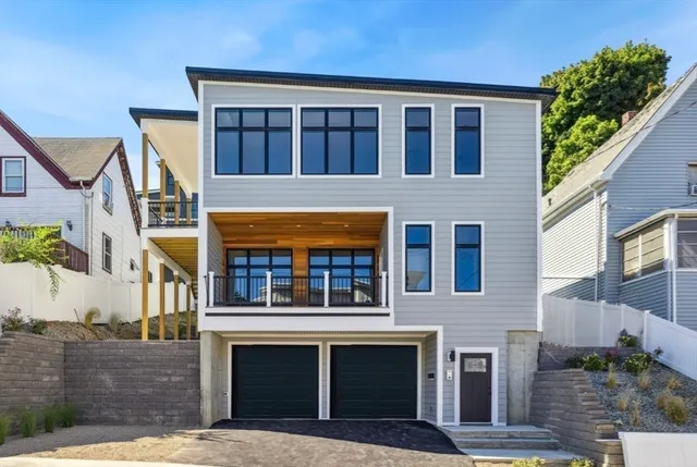 a front view of a house with glass windows