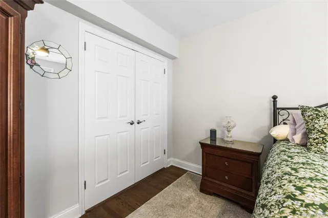 a bed room with a bed and a dresser