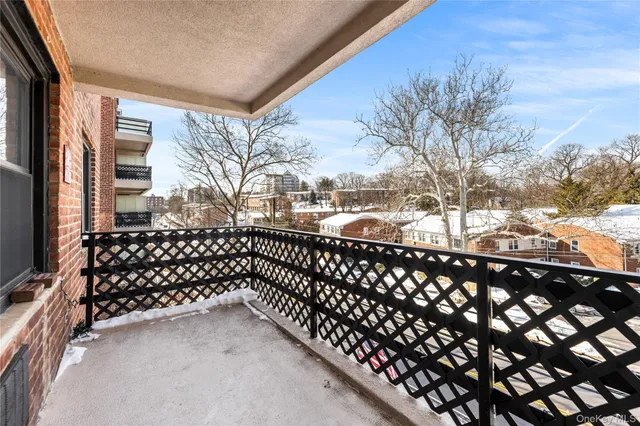 a utility room with dryer washer and a view of kitchen