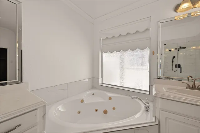 a bathroom with a tub and a sink