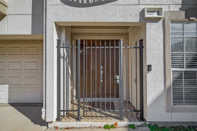 a view of a house with a door and wooden floor