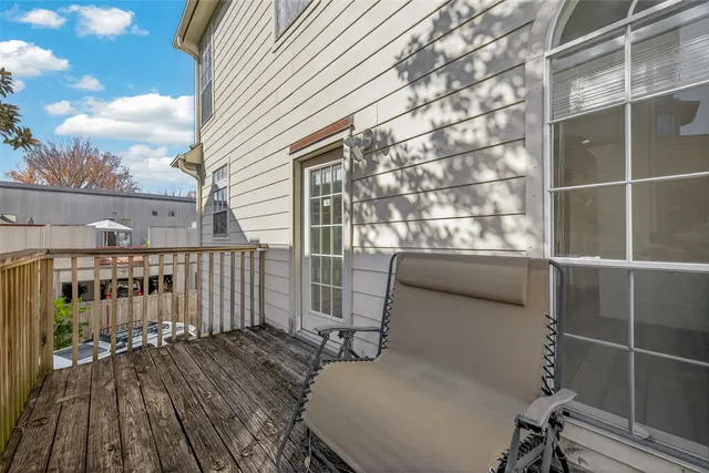 a view of a balcony with furniture
