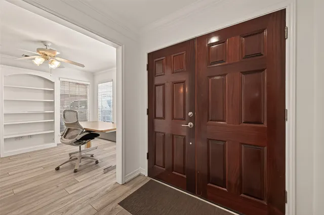 a workspace with wooden floor and windows