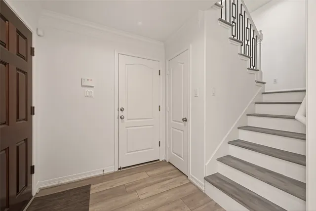 a view of entryway with wooden floor