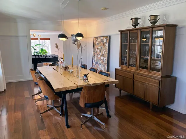 a view of a dining room with furniture and window