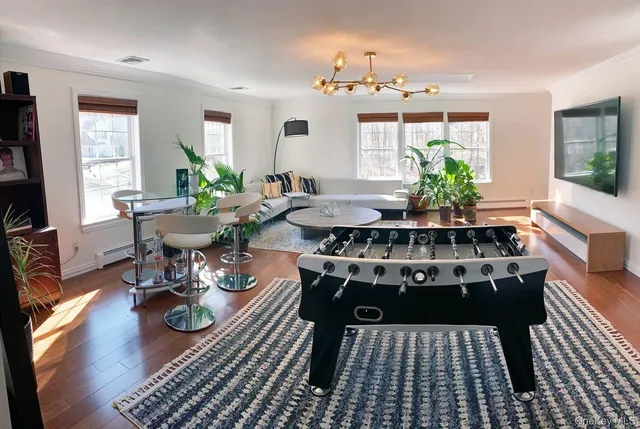 a living room with furniture a window and a table