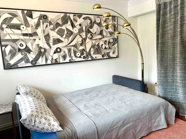 a view of a hallway with a potted plant