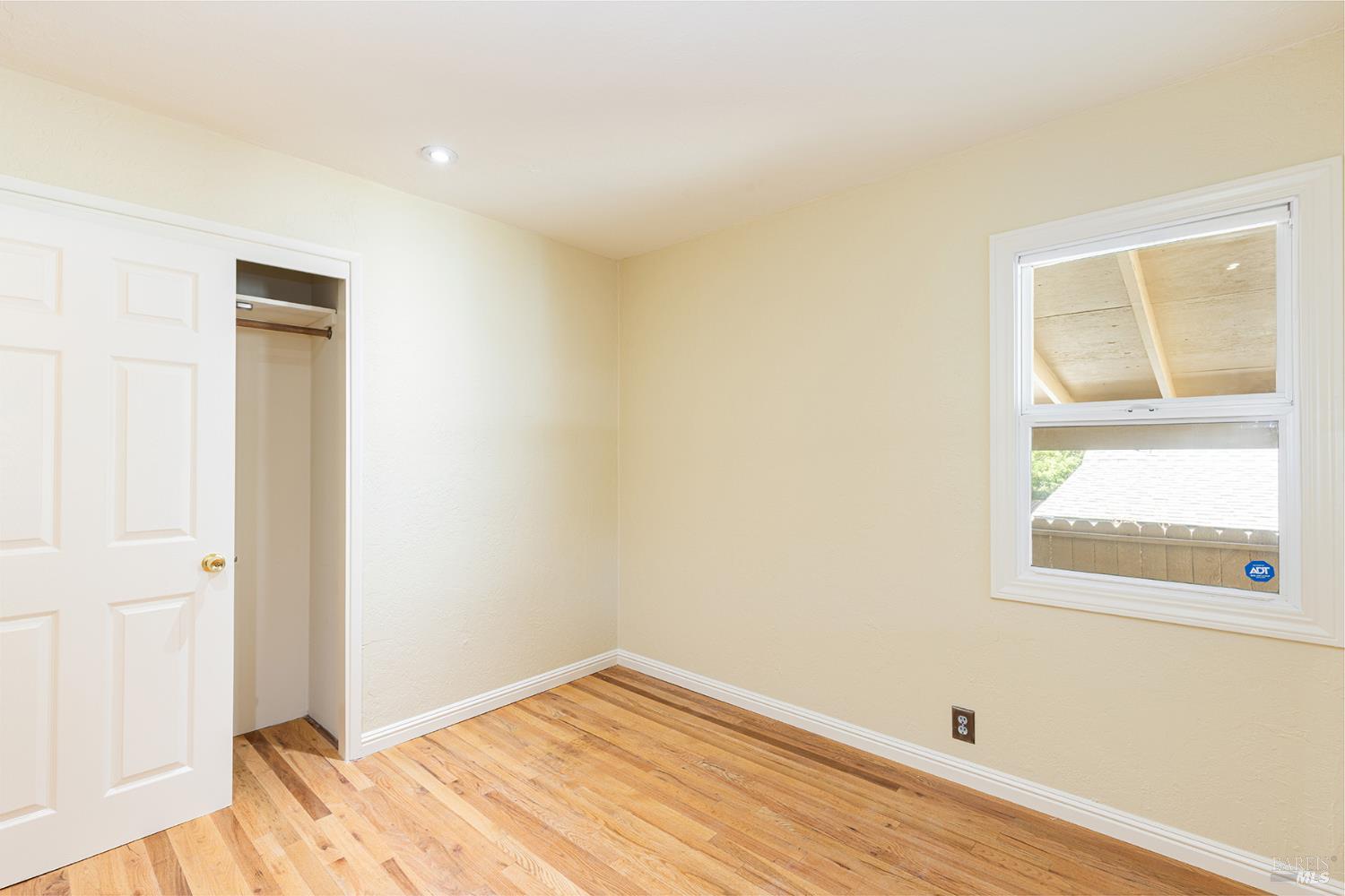 18090 Las Lomas Road Sonoma, CA 95476 - Photo 17 of 37 a view of room with window and wooden floor