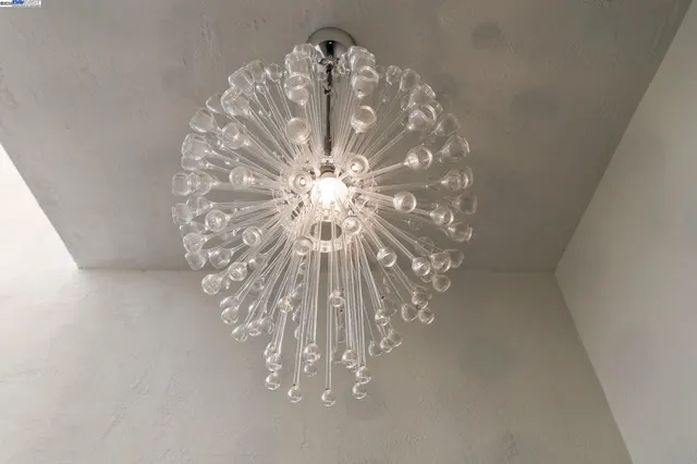 a vase of white vase sitting on a table