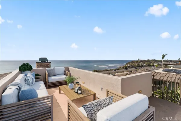 a dining room with a wooden table and chairs
