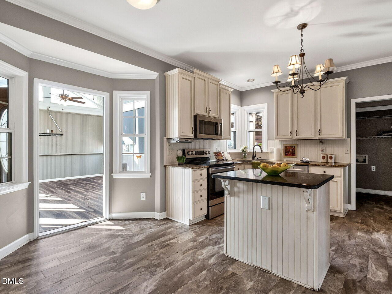 4500 Rivershyre Way Raleigh, NC 27616 - Photo 13 of 42 a kitchen with kitchen island granite countertop a sink appliances cabinets and a counter top space