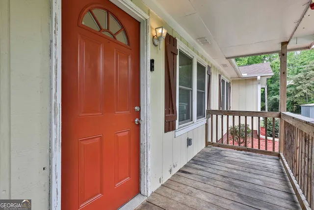 a view of a balcony with wooden floor