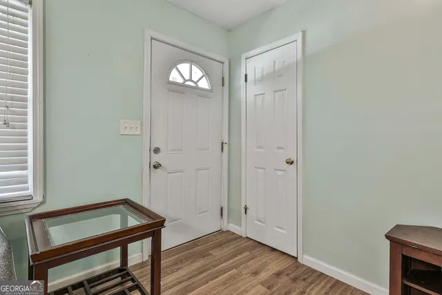 a room with a bench and a window