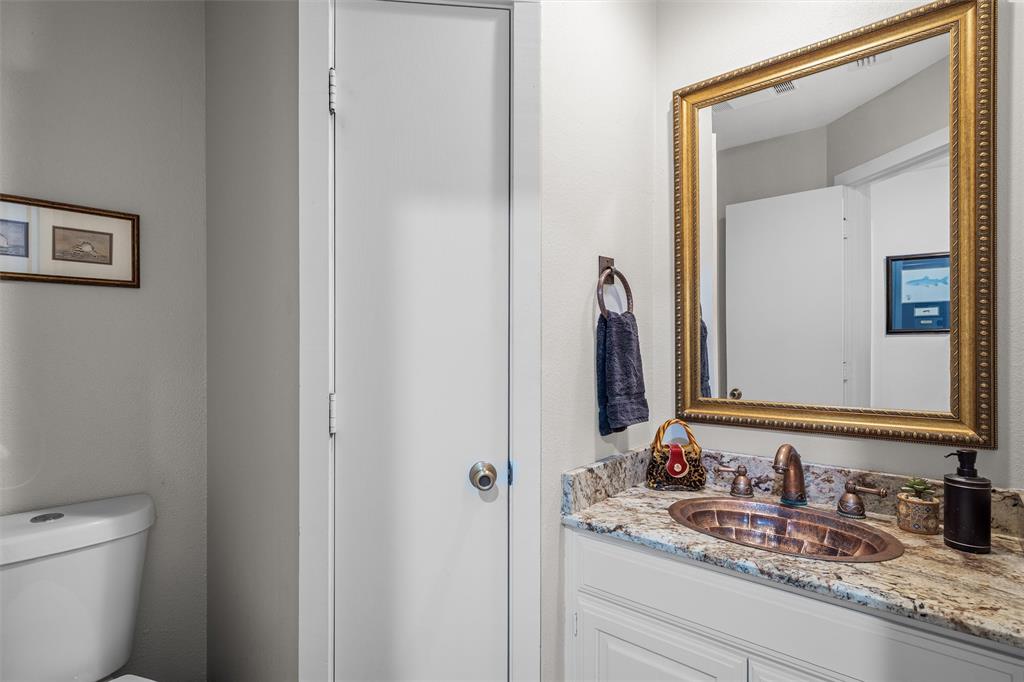148 Pinewood Cove Holly Lake Ranch, TX 75765 - Photo 25 of 40 a bathroom with a granite countertop sink and a mirror
