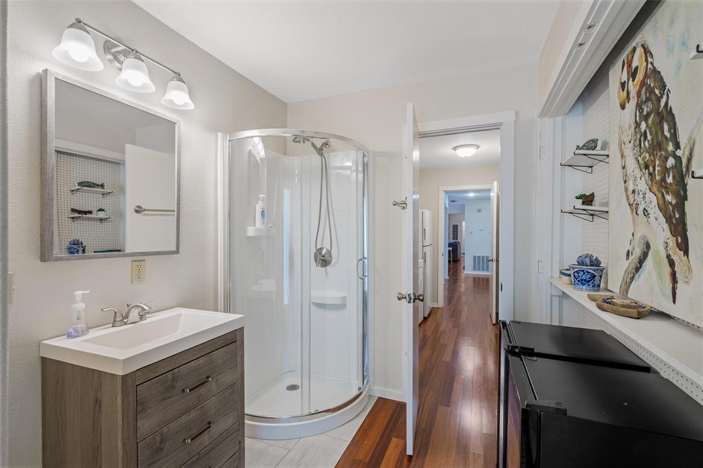 148 Pinewood Cove Holly Lake Ranch, TX 75765 - Photo 28 of 40 a bathroom with a sink a toilet and shower