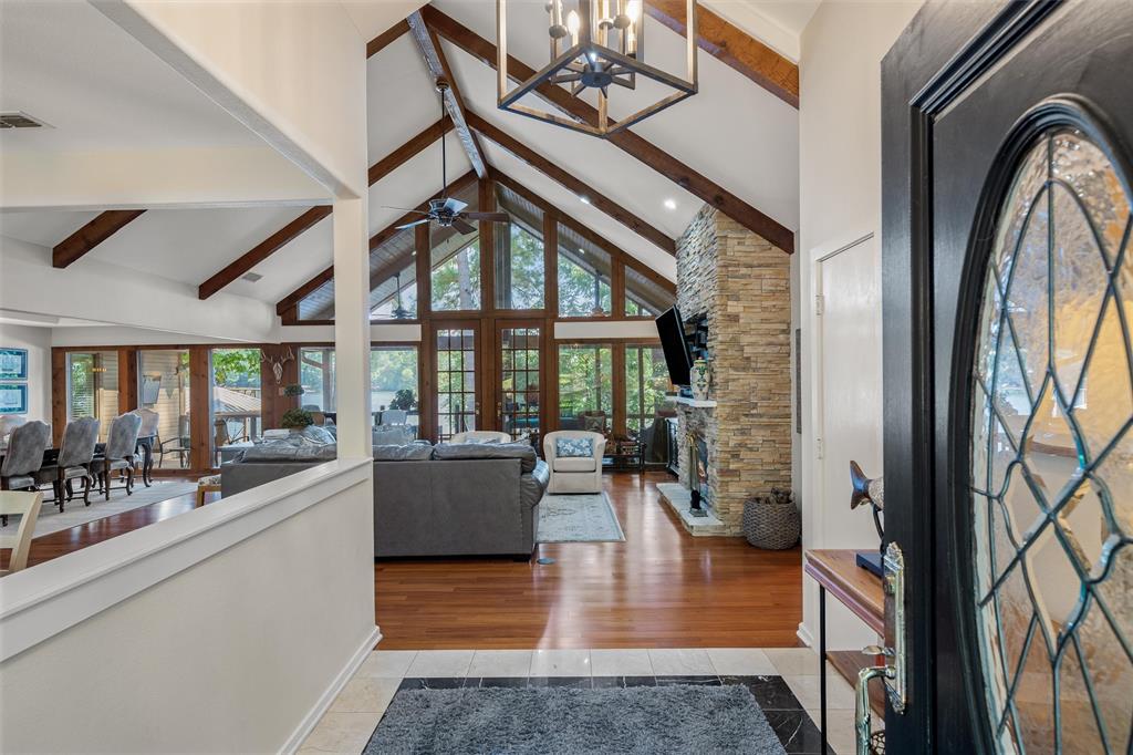 148 Pinewood Cove Holly Lake Ranch, TX 75765 - Photo 4 of 40 a view of living room with furniture and floor to ceiling window