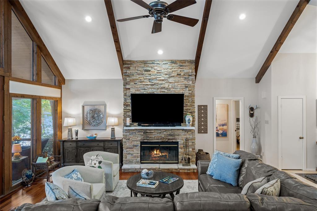 148 Pinewood Cove Holly Lake Ranch, TX 75765 - Photo 9 of 40 a living room with furniture and a fireplace