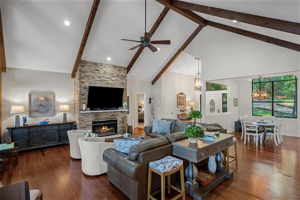 148 Pinewood Cove Holly Lake Ranch, TX 75765 - Photo 10 of 40 a living room with fireplace furniture and a flat screen tv