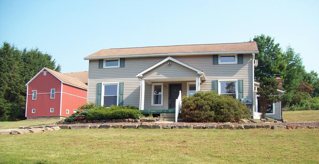 28014 State Rte 27 Guys Mills, PA 16327 - Photo 1 of 22 a front view of a house with a yard