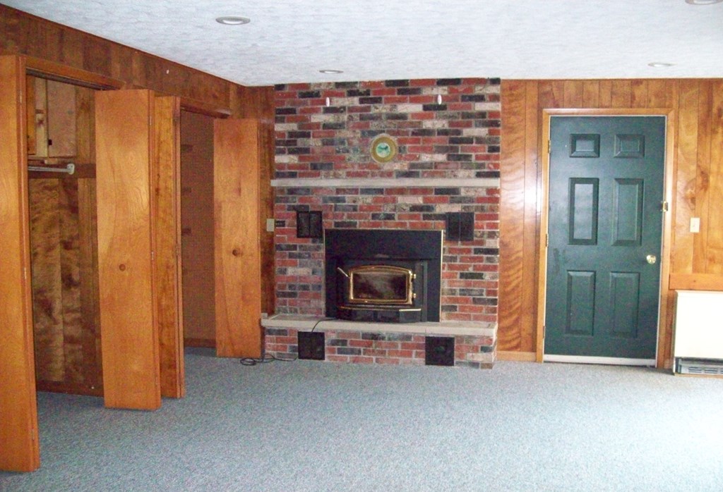 28014 State Rte 27 Guys Mills, PA 16327 - Photo 9 of 22 a living room with furniture and a fireplace