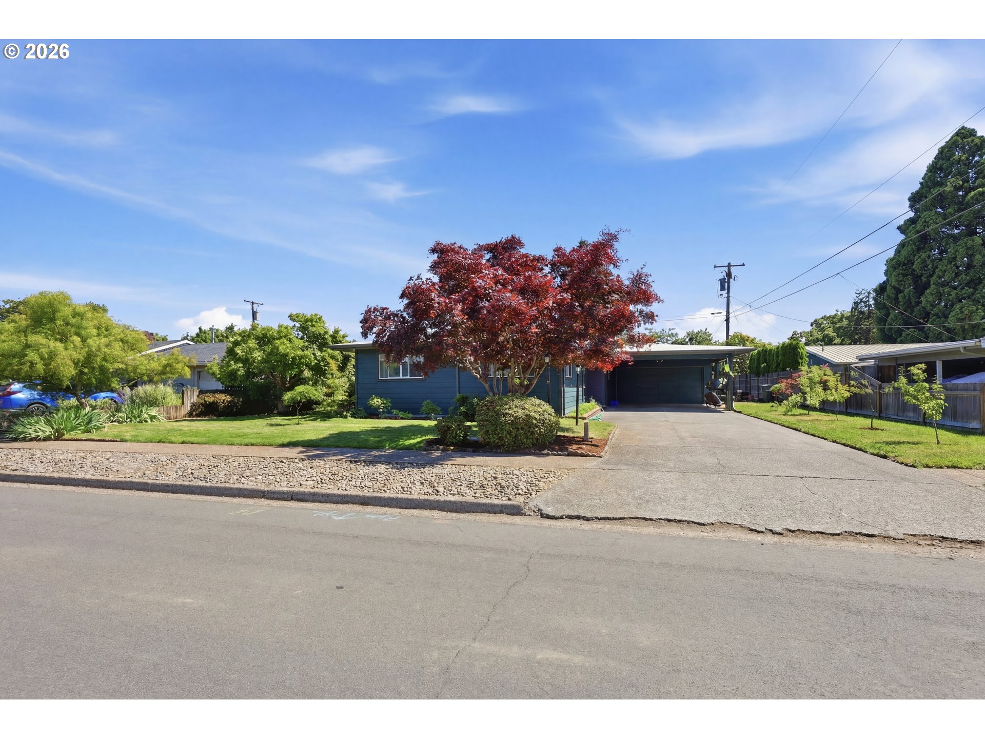 65 Greenvale Drive Springfield, OR 97477 - Photo 41 of 42 a view of a road with a building in the background