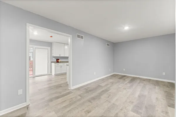 a view of a livingroom with wooden floor