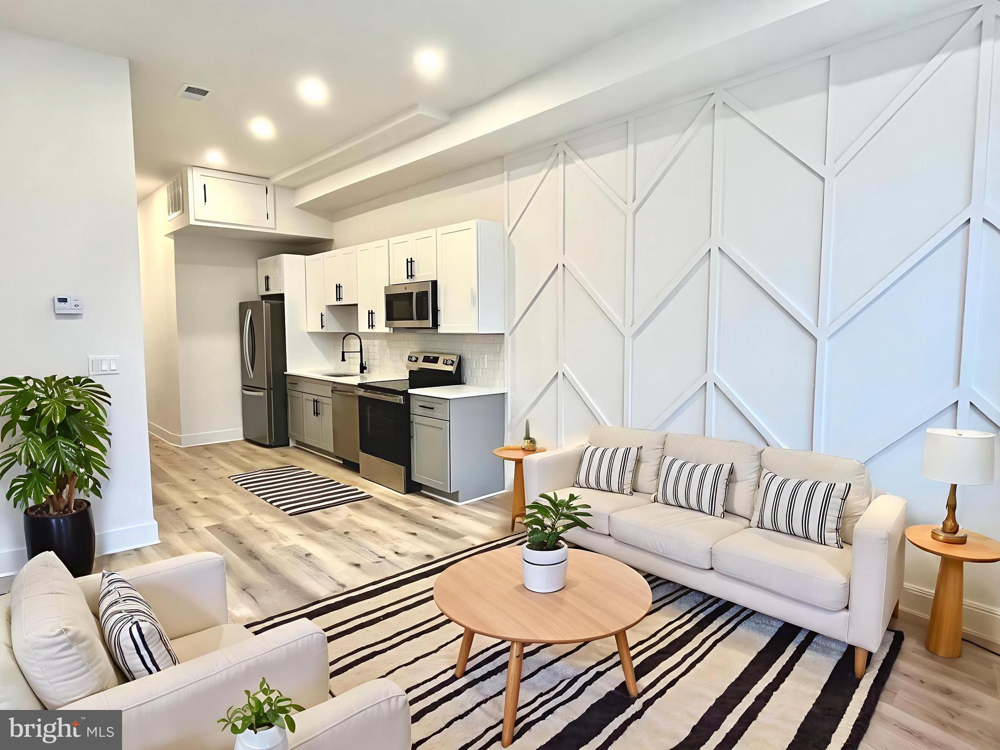 1802 11th Street Northwest, Unit 2A Washington, DC 20001 - Photo 2 of 15 a view of kitchen and dining room with wooden floor