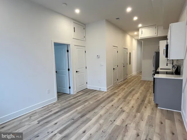 a view of a kitchen with wooden floor