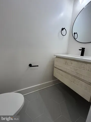 a bathroom with a sink and mirror