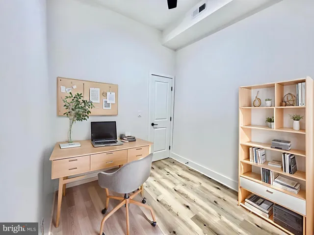 a workspace with furniture and bookshelf