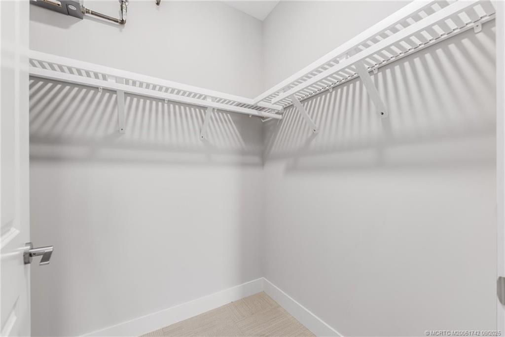 41 Southwest Seminole Street, Unit 305 Stuart, FL 34994 - Photo 18 of 50 a view of a room with racks on the wall