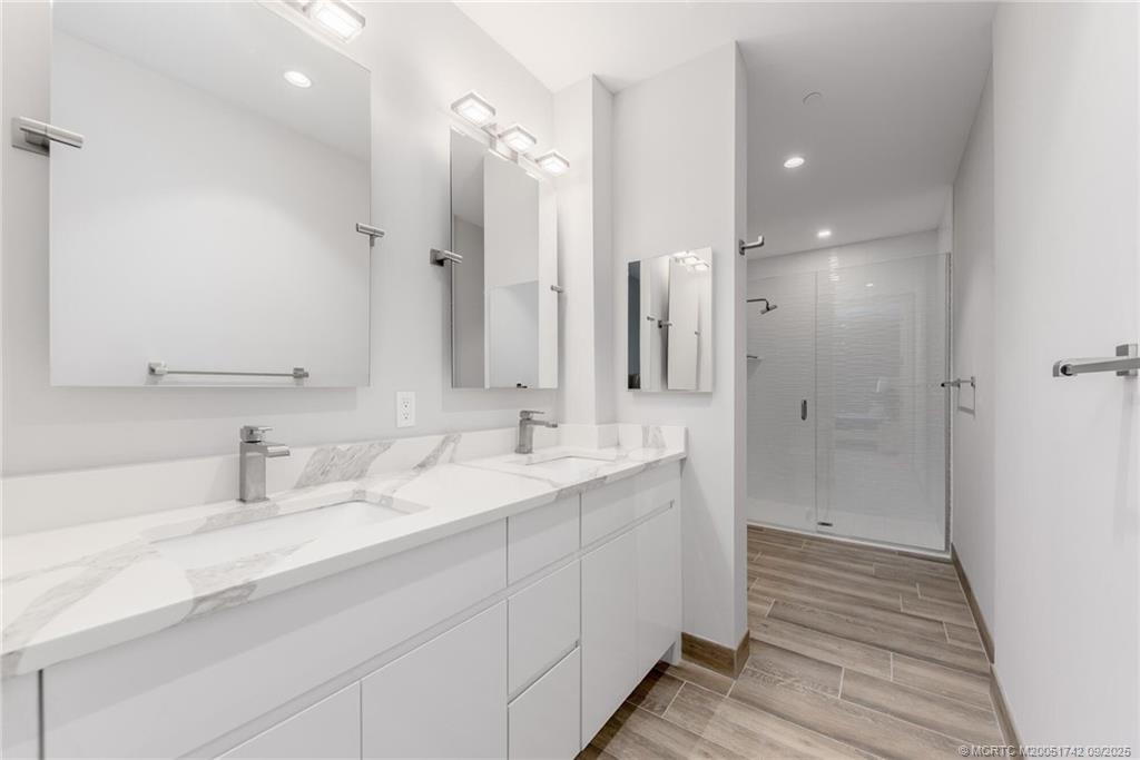 41 Southwest Seminole Street, Unit 305 Stuart, FL 34994 - Photo 19 of 50 a bathroom with a sink and a mirror