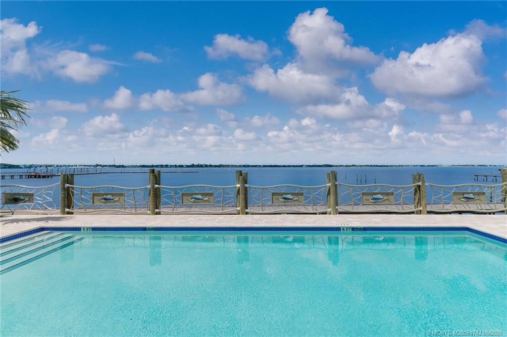 41 Southwest Seminole Street, Unit 305 Stuart, FL 34994 - Photo 2 of 50 a aerial view of a house with a yard