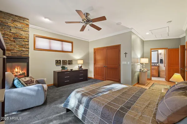 a bathroom with a granite countertop tub a double vanity sink a window and mirror