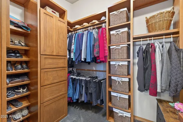 a bathroom with a granite countertop toilet a sink and a mirror