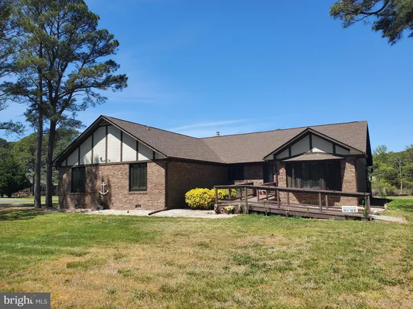 a front view of house with outdoor space