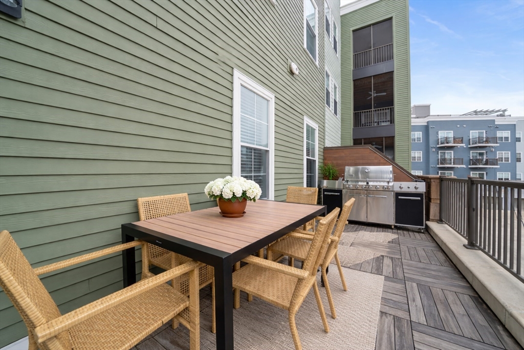 200 Revere Street, Unit 4104 Canton, MA 02021 - Photo 16 of 28 a view of deck and patio
