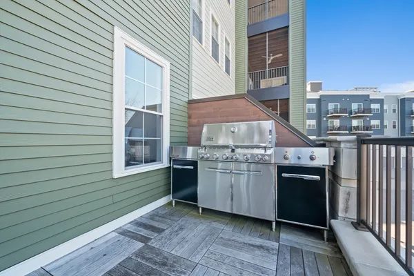 a kitchen with stainless steel appliances granite countertop a stove and a refrigerator