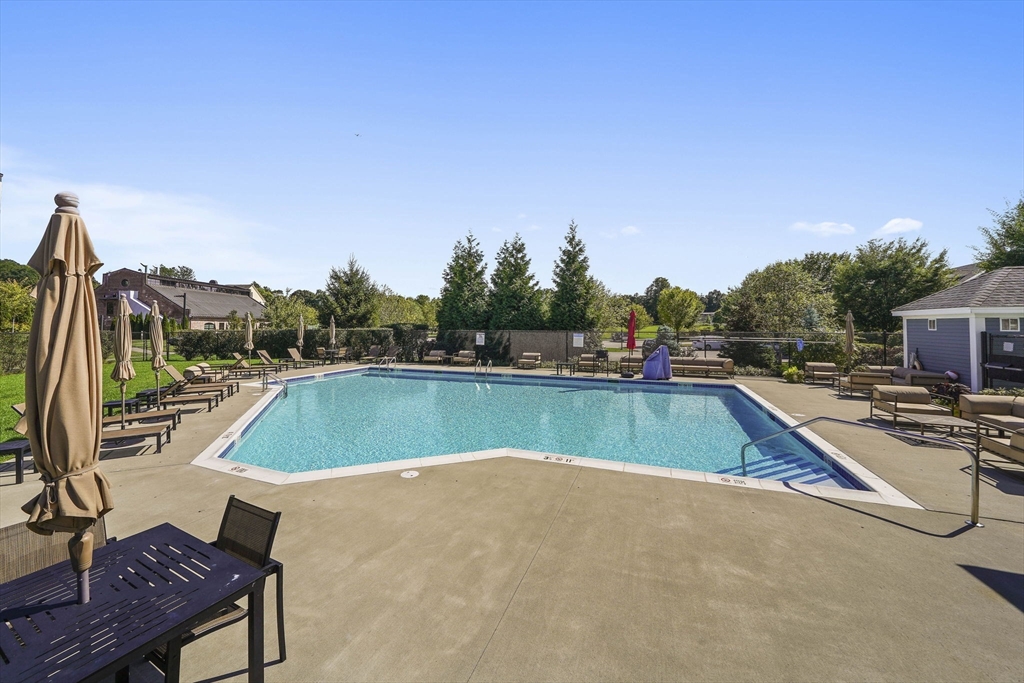 200 Revere Street, Unit 4104 Canton, MA 02021 - Photo 28 of 28 a view of swimming pool with chairs