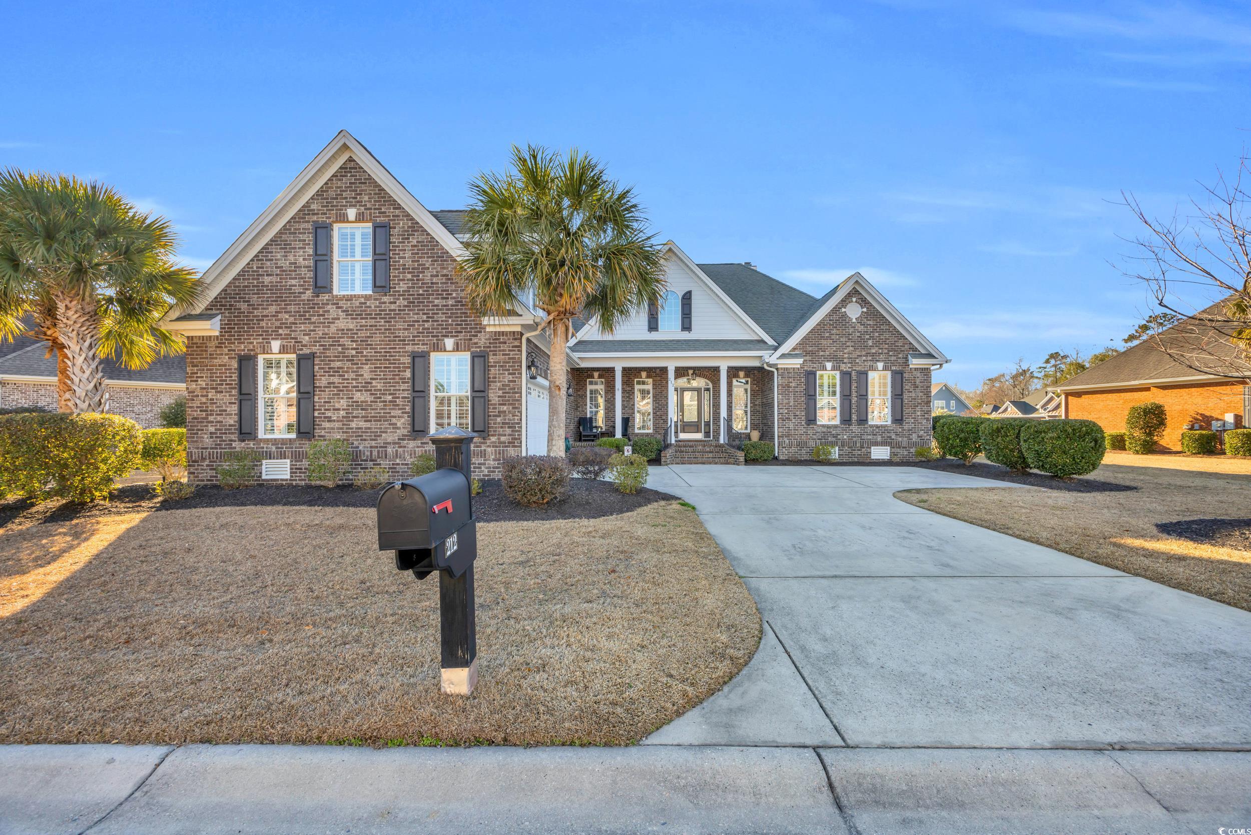 212 Minnow Lane Murrells Inlet, SC 29576 - Photo 1 of 37 View of front of home featuring a porch