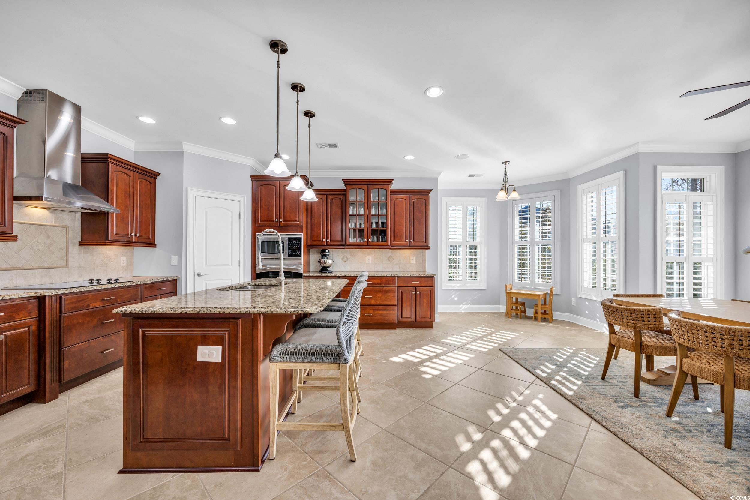 212 Minnow Lane Murrells Inlet, SC 29576 - Photo 9 of 37 Kitchen with decorative light fixtures, stovetop,