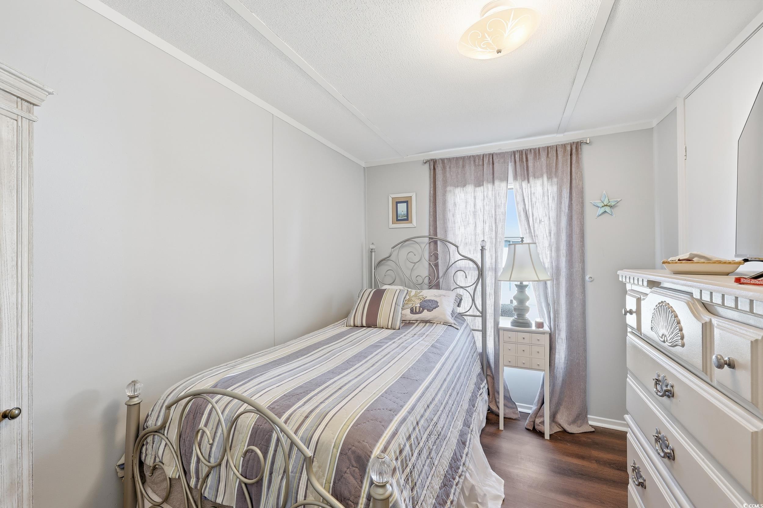 1017 Foxfire Drive North Myrtle Beach, SC 29582 - Photo 19 of 36 Bedroom with dark wood-style flooring
