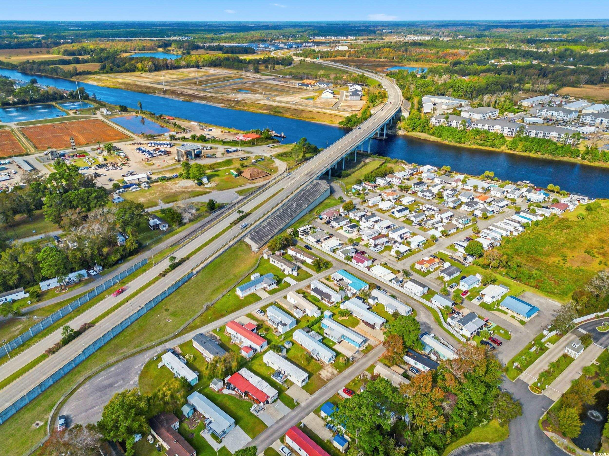 1017 Foxfire Drive North Myrtle Beach, SC 29582 - Photo 29 of 36 Aerial overview of property's location featuring a notable bridge and a nearby body of water