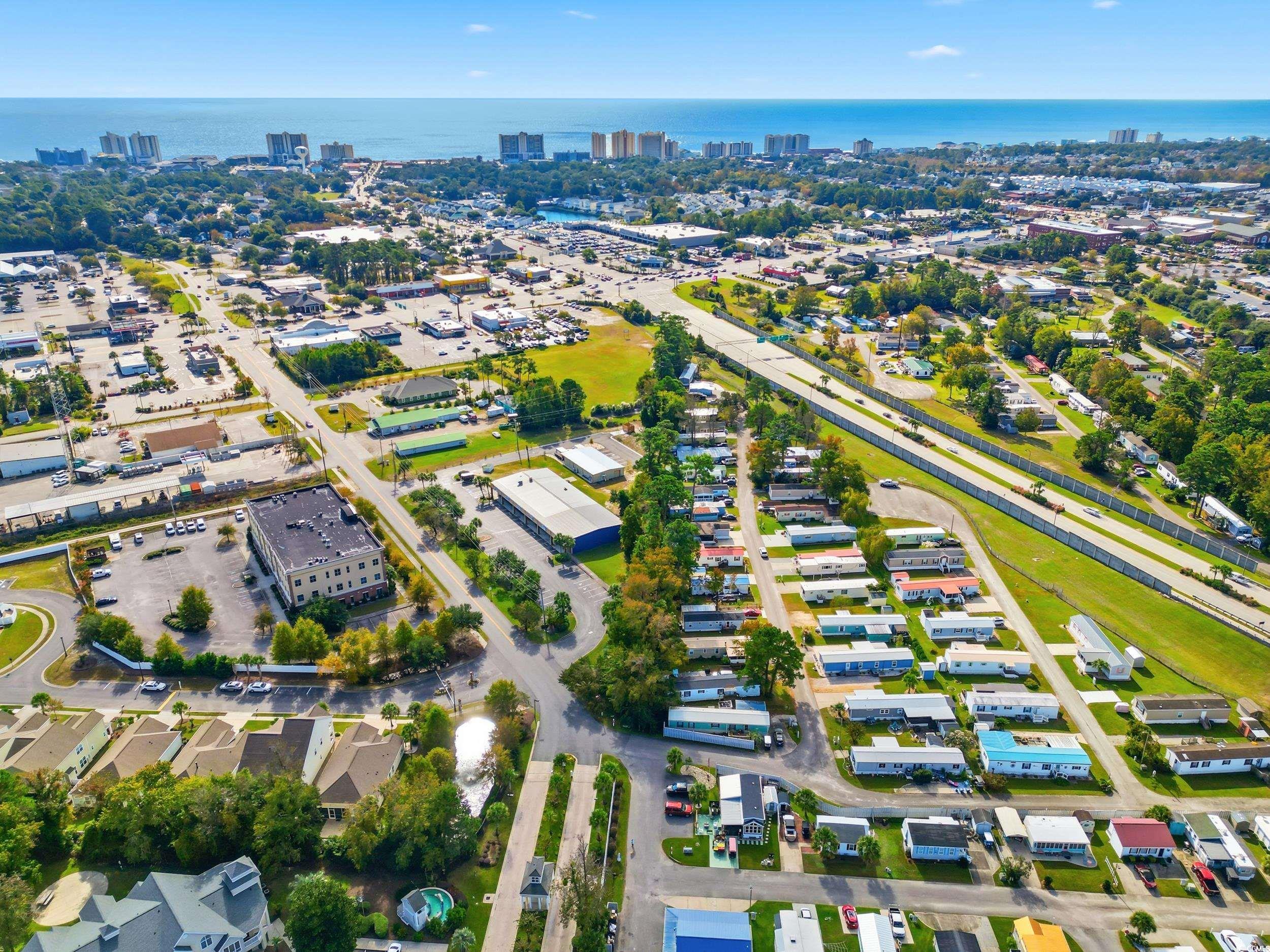 1017 Foxfire Drive North Myrtle Beach, SC 29582 - Photo 34 of 36 Aerial view of property and surrounding area with nearby urban area