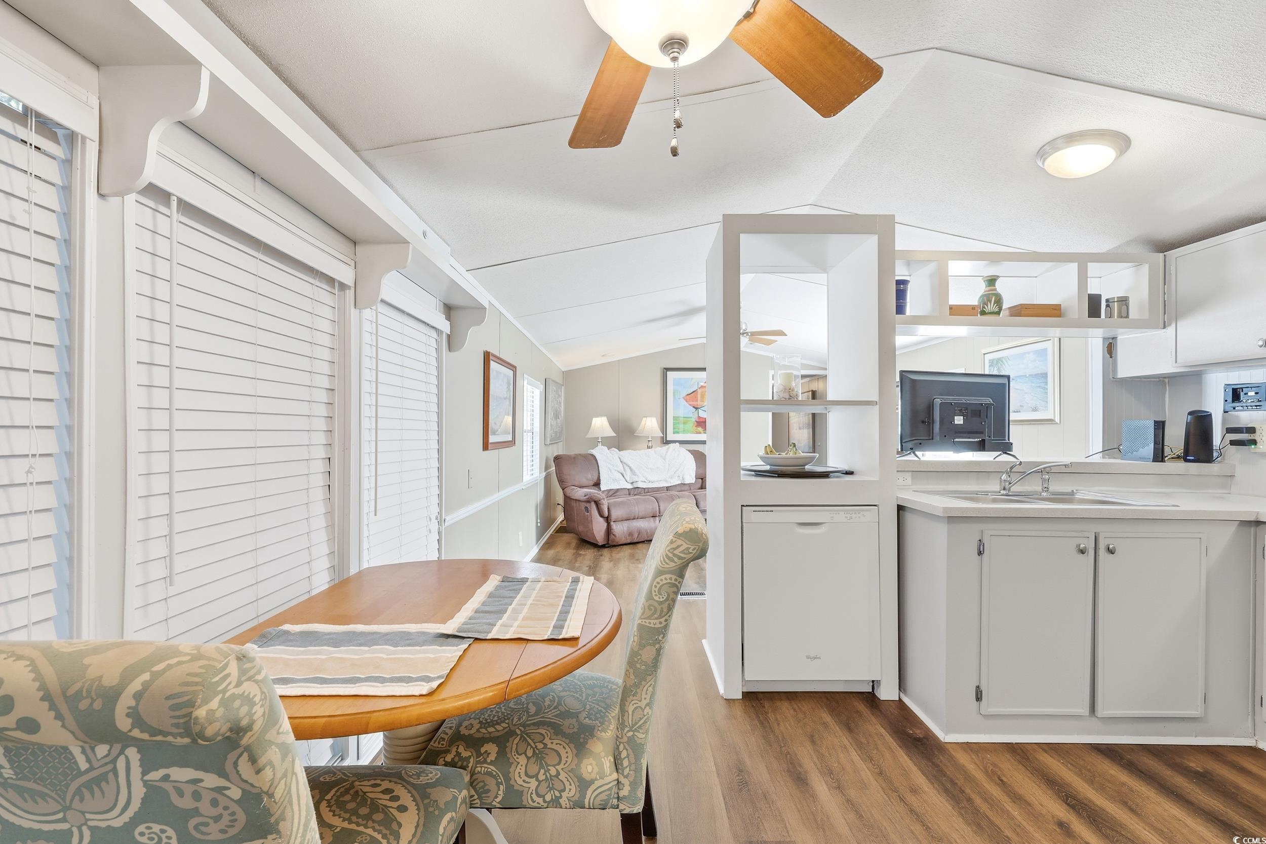 1017 Foxfire Drive North Myrtle Beach, SC 29582 - Photo 9 of 36 Dining space with lofted ceiling, light wood-style flooring, and ceiling fan